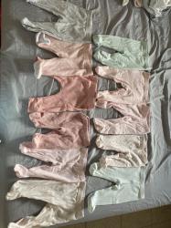 מגוון בגדי תינוקות במידות סמול