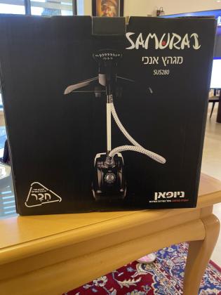 מגהץ אנכי חדש באריזה, התקבל